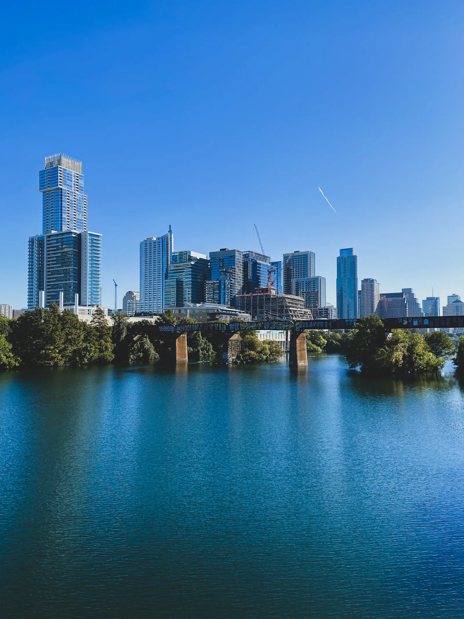 Downtown Austin office towers above the water of Lady Bird Lake