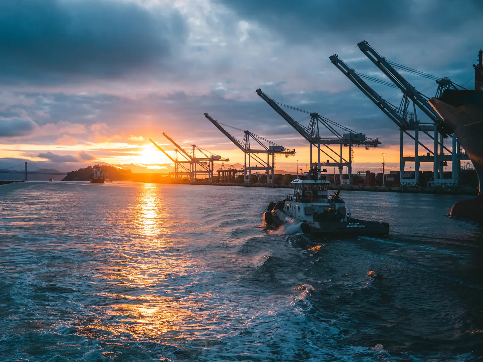 Container cranes at the Port of Oakland at sunset