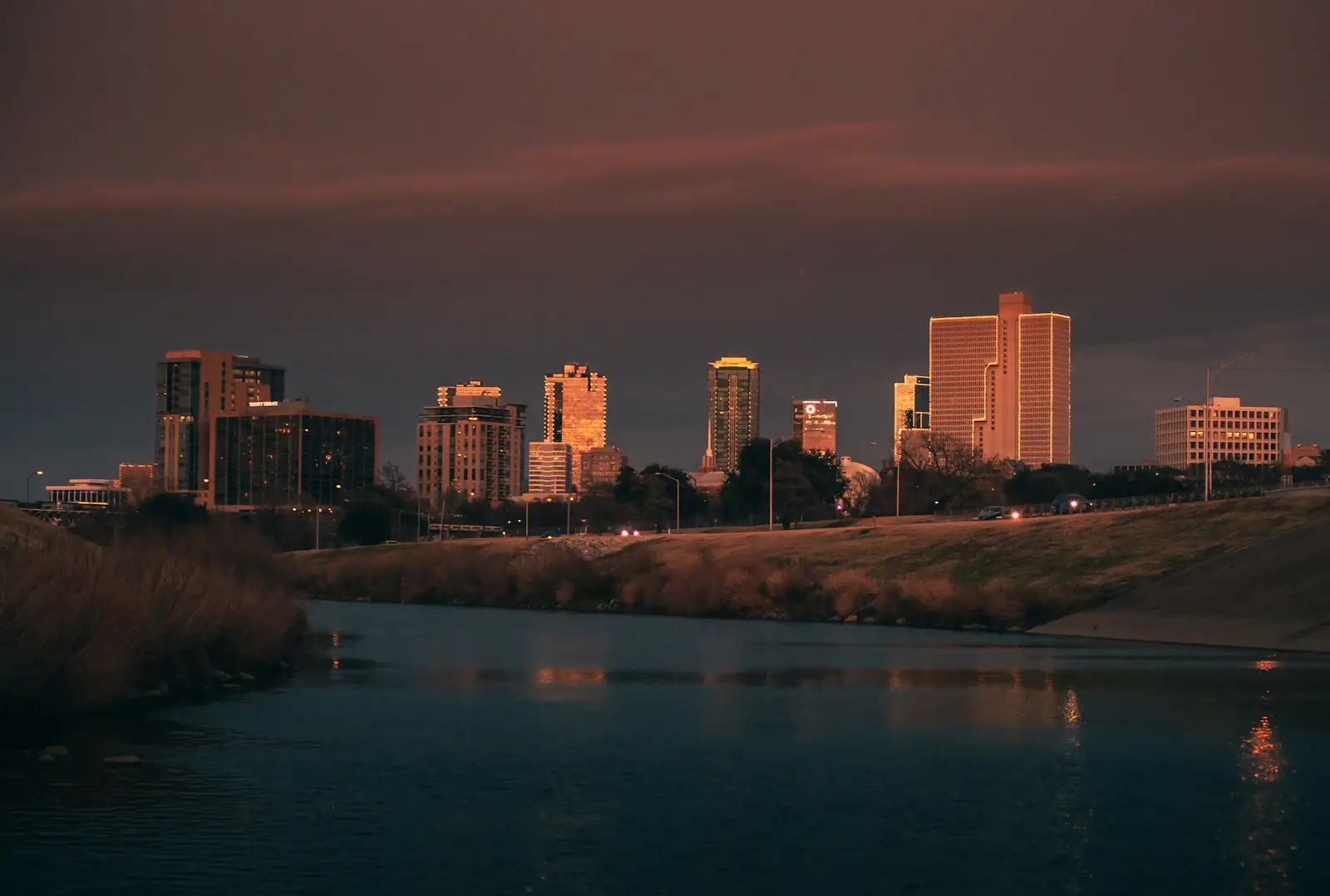 Fort Worth office towers at night above the Trinity River