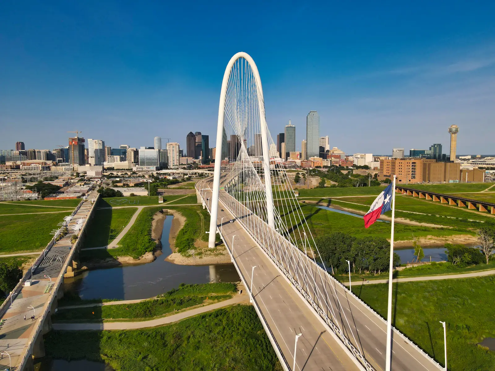Margaret Hunt Hill Bridge with the Dallas skyline behind it, from Trinity Groves