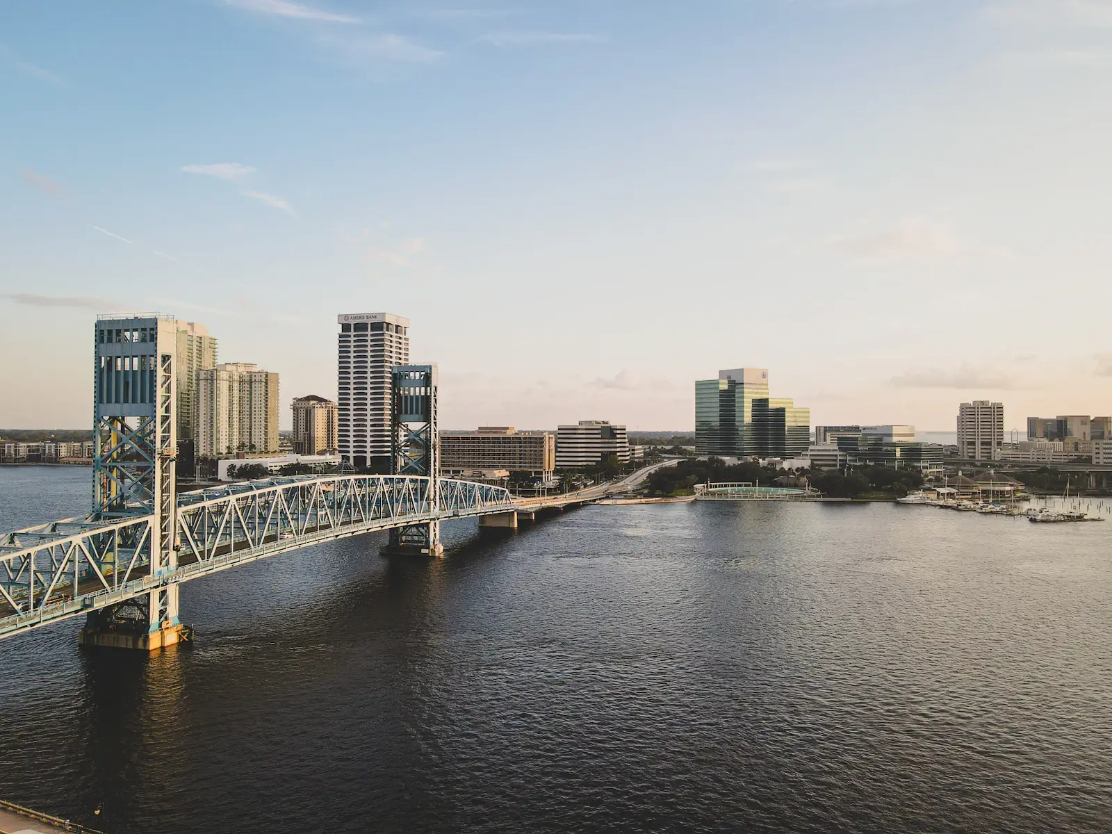 Bridge crossing the St. Johns River with downtown Jacksonville towers behind it
