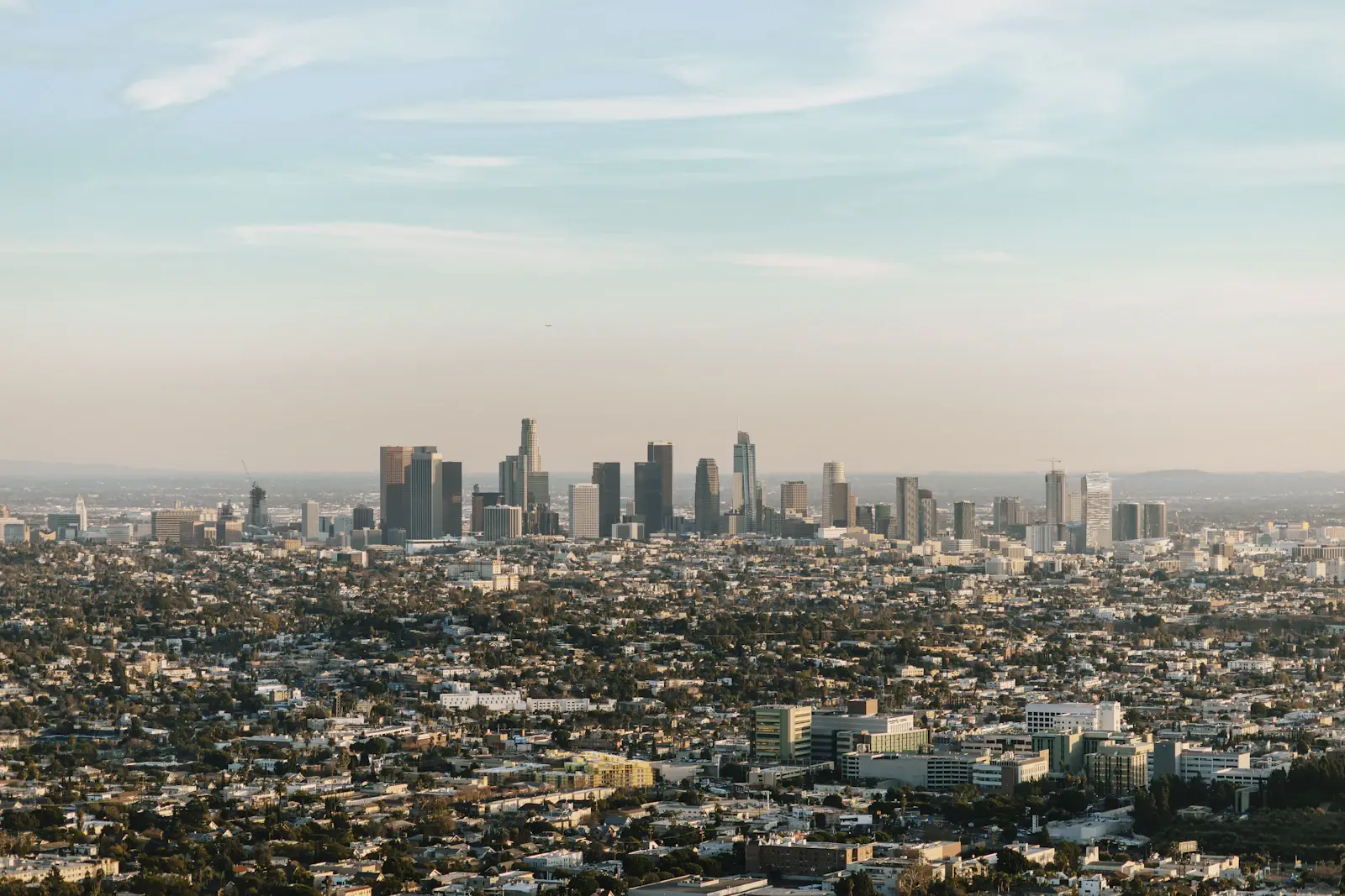 Downtown Los Angeles skyline under a clear blue sky
