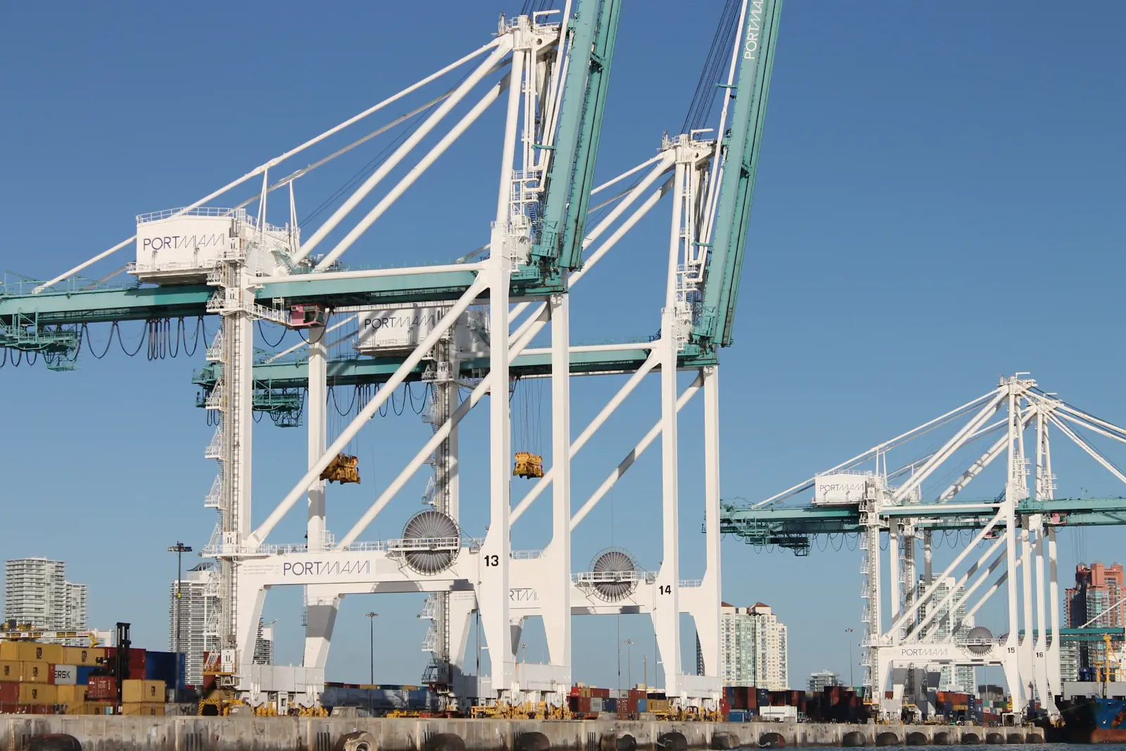 Container cranes lined up along the docks at PortMiami