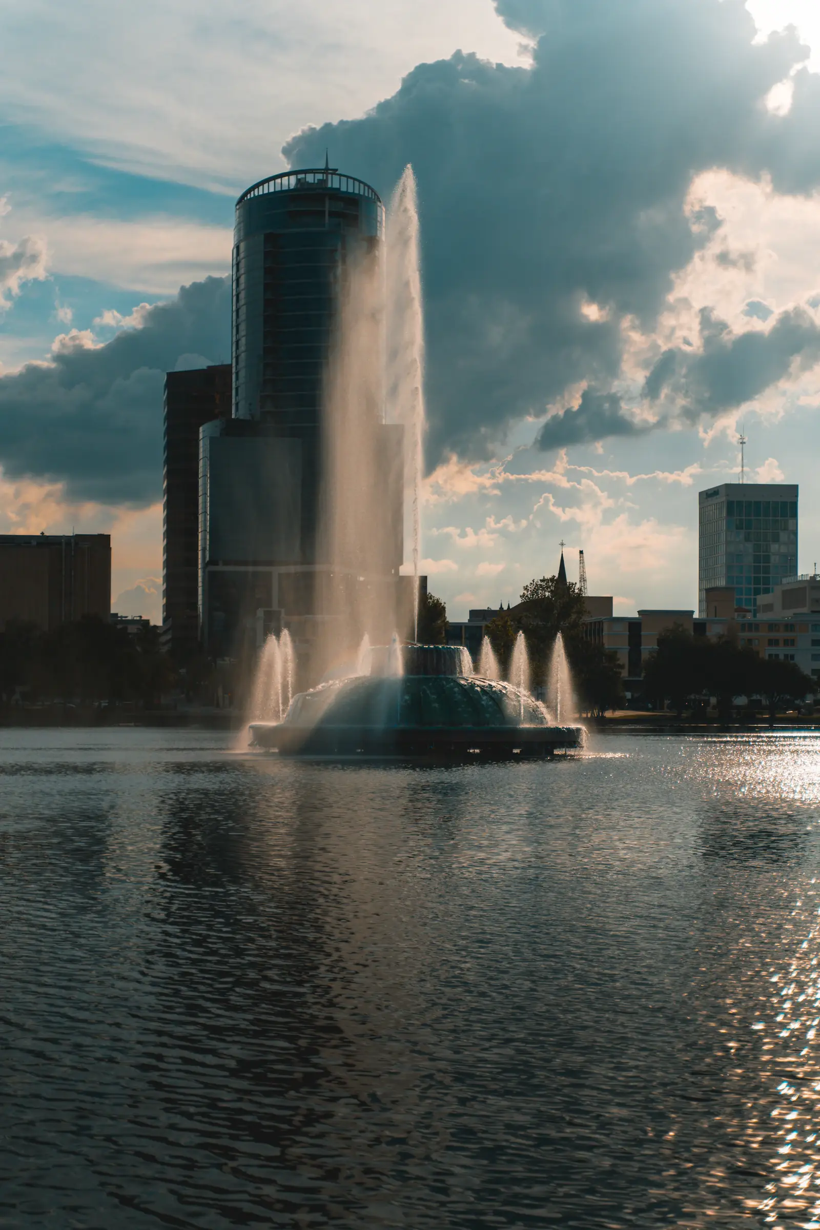 The Lake Eola fountain with downtown Orlando office buildings behind it
