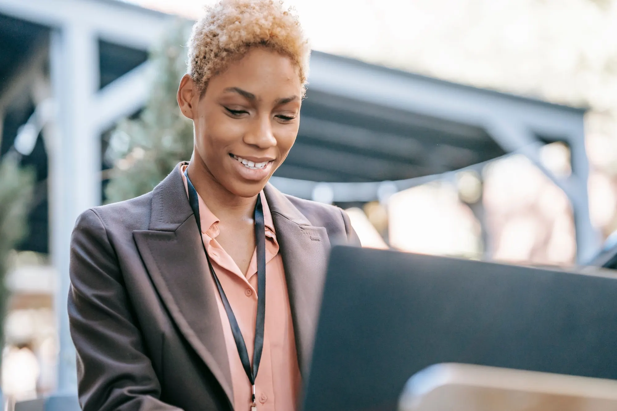 Smiling businesswoman working on a laptop