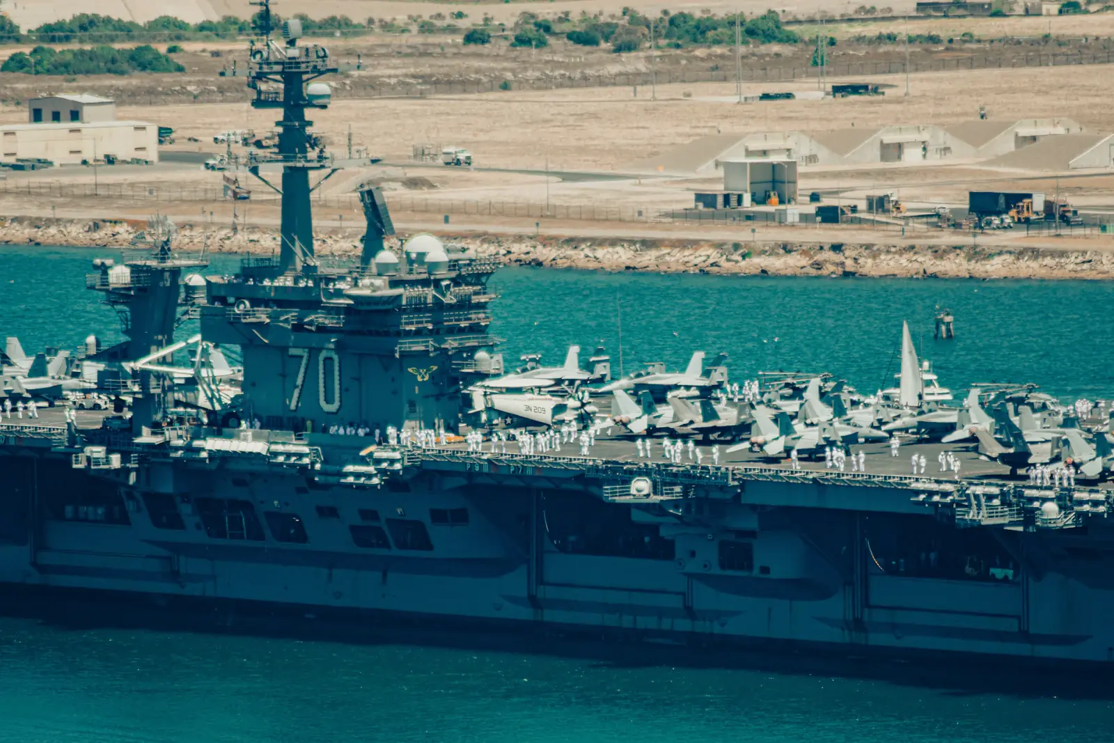 A Navy ship moving through San Diego Bay, seen from Point Loma